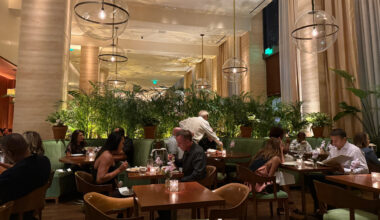Food and the dining room at Lilac at the Edition Tampa