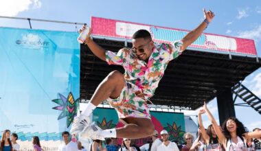 Festival-goer jumping with joy in front of the SOBEWFF stage on Miami Beach
