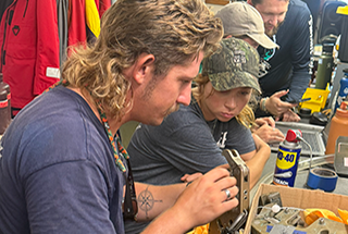 Orion Scharton-Witmer and Lillian Ring troubleshoot issues with mechanisms on a recent research cruise.