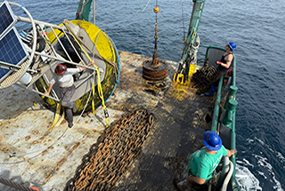 Recovering a buoy means hauling thousands of pounds of chain and anchor onto the deck.