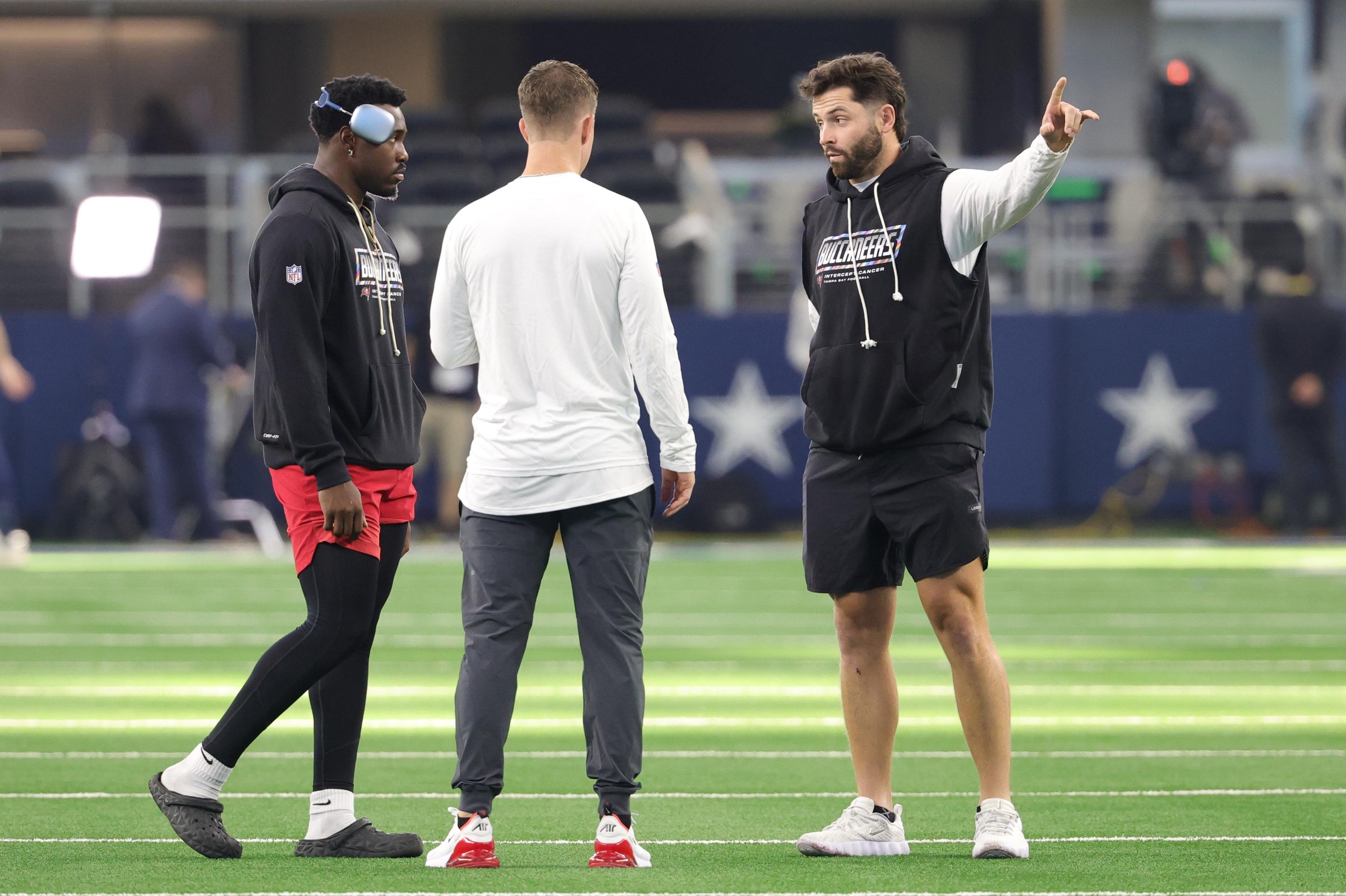 Oct 8, 2026; Arlington, Texas, USA; Tampa Bay Buccaneers quarterback Baker Mayfield (right) speaks to Tampa Bay Buccaneers quarterback Jalon Daniels (left) before the game at AT&T Stadium. Mandatory Credit: Kevin Jairaj-Imagn Images