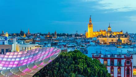Seville at night, showcasing its stunning skyline.