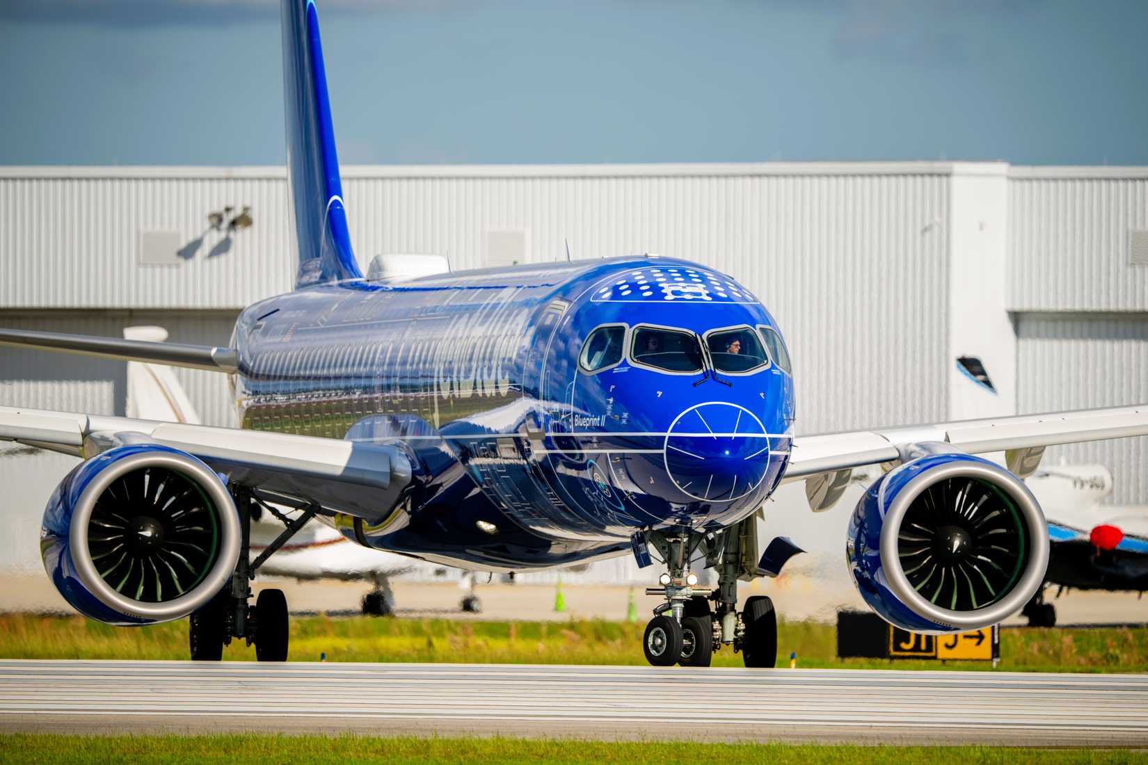 Front view of JetBlue Airbus A220-300 with Blueprint special livery at Fort Lauderdale
