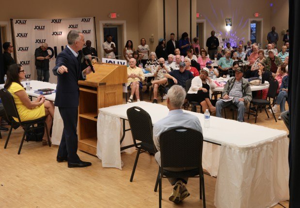 People listen as Florida Democratic gubernatorial candidate David Jolly speaks during a campaign event at the Wynmoor Democratic Club on Monday, Oct. 5, 2026 in Coconut Creek. (Joe Raedle/Getty Images)