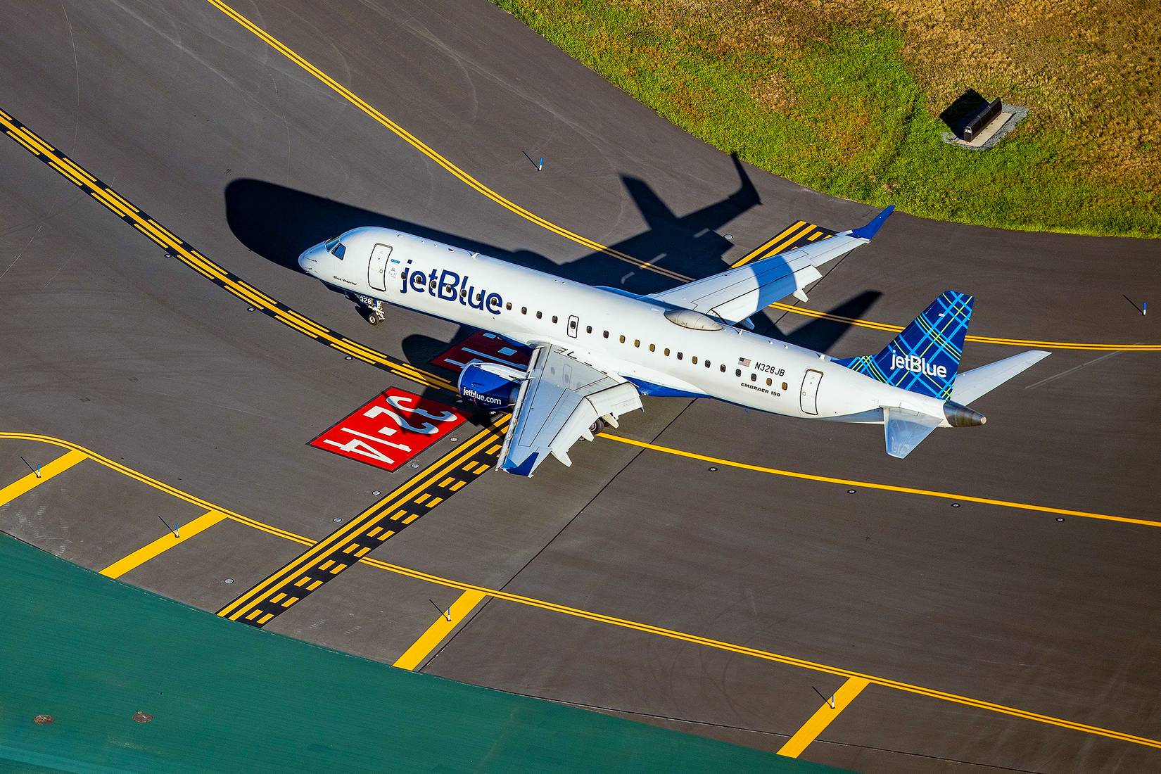JetBlue plane taxiing on the runway at Boston Logan Airport in East Boston, Massachusetts, USA