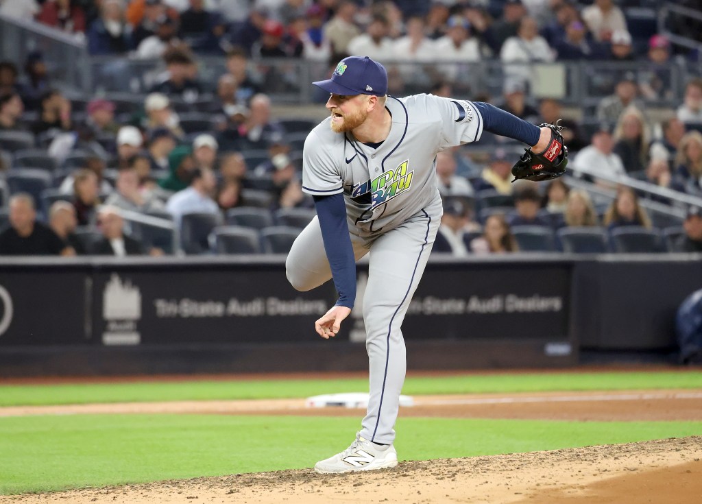Tampa Bay Rays pitcher Drew Rasmussen throws a pitch during a game against the New York Yankees at Yankee Stadium.
