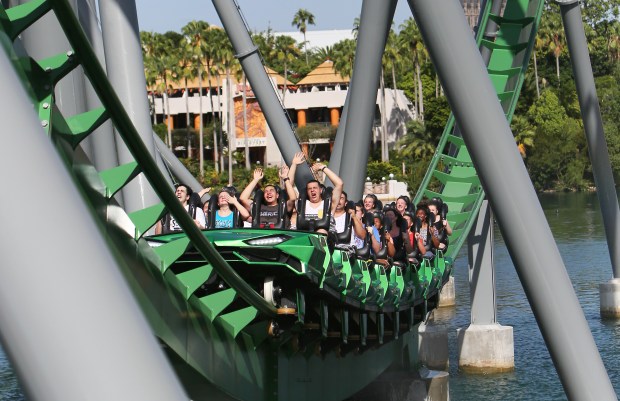 Guests ride the revamped Incredible Hulk Roller Coaster at Islands of Adventure in Orlando on Wednesday, August 3, 2016. (Jacob Langston/Orlando Sentinel)