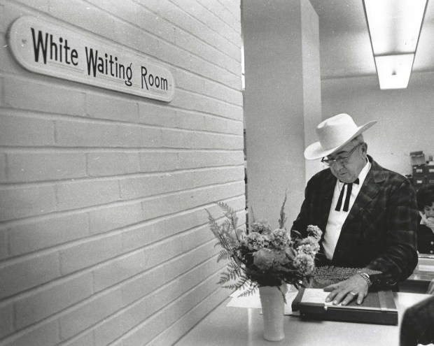 In this 1971 photo, notorious Lake County Sheriff Willis McCall stands next to a formerly segregated waiting room. (Orlando Sentinel file)