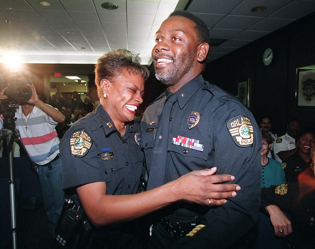 Jerry Demings gets a hug from his wife, Capt. Val Demings, after being named Orlando's first Black police chief in 1998. Val Demings would later become the department's first woman chief. (Orlando Sentinel file)