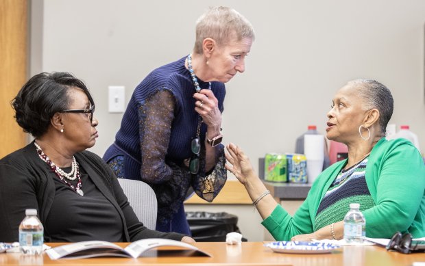 At a 2023 workshop on the making of the "Oscar Mack vs. The Ku Klux Klan," Mack's great granddaughter, Vanessa Bonner, left, listens as Renee Bronson, middle, the great granddaughter of KKK member Stewart Ivey, speaks with Juanita Lesesne, right, a descendant of one of Osceola County's most prominent families. (Orlando Sentinel file)