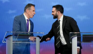 Andrew Cuomo (L) greets Democratic nominee Zohran Mamdani before participating in a mayoral debate at Rockefeller Center on October 16, 2025 in New York City.
