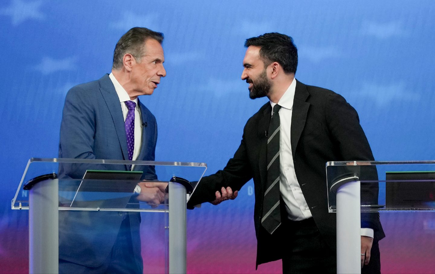 Andrew Cuomo (L) greets Democratic nominee Zohran Mamdani before participating in a mayoral debate at Rockefeller Center on October 16, 2025 in New York City.