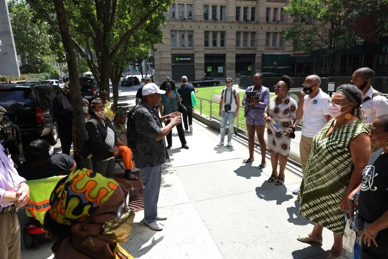 People gather for the start of a reparations rally at the African Burial Ground National Monument in New York in 2021. (Michael M. Santiago/Getty Images)