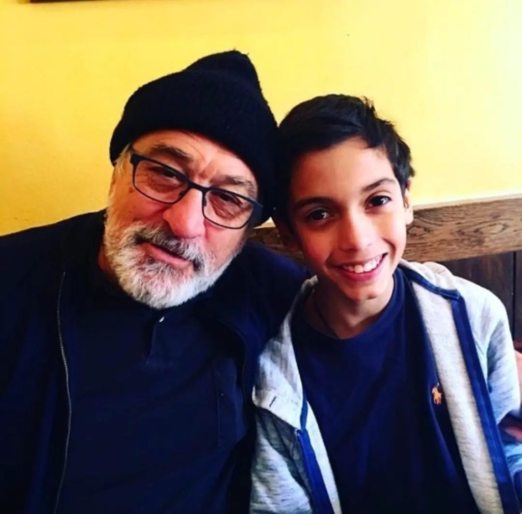 Robert De Niro and his grandson, Leandro De Niro Rodriguez, smiling for a photo.