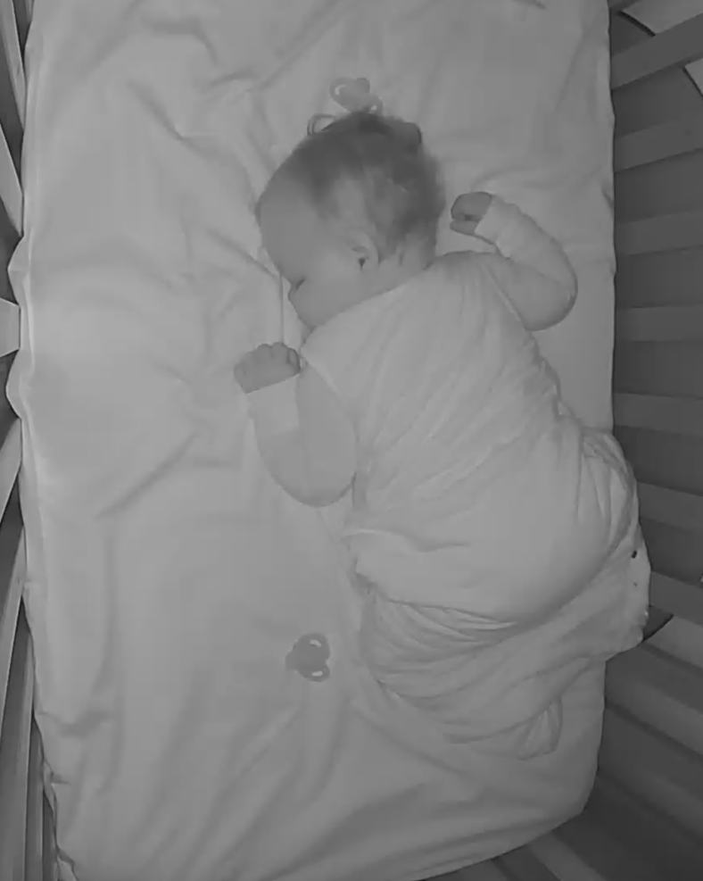 sofia sleeping in crib at hotel