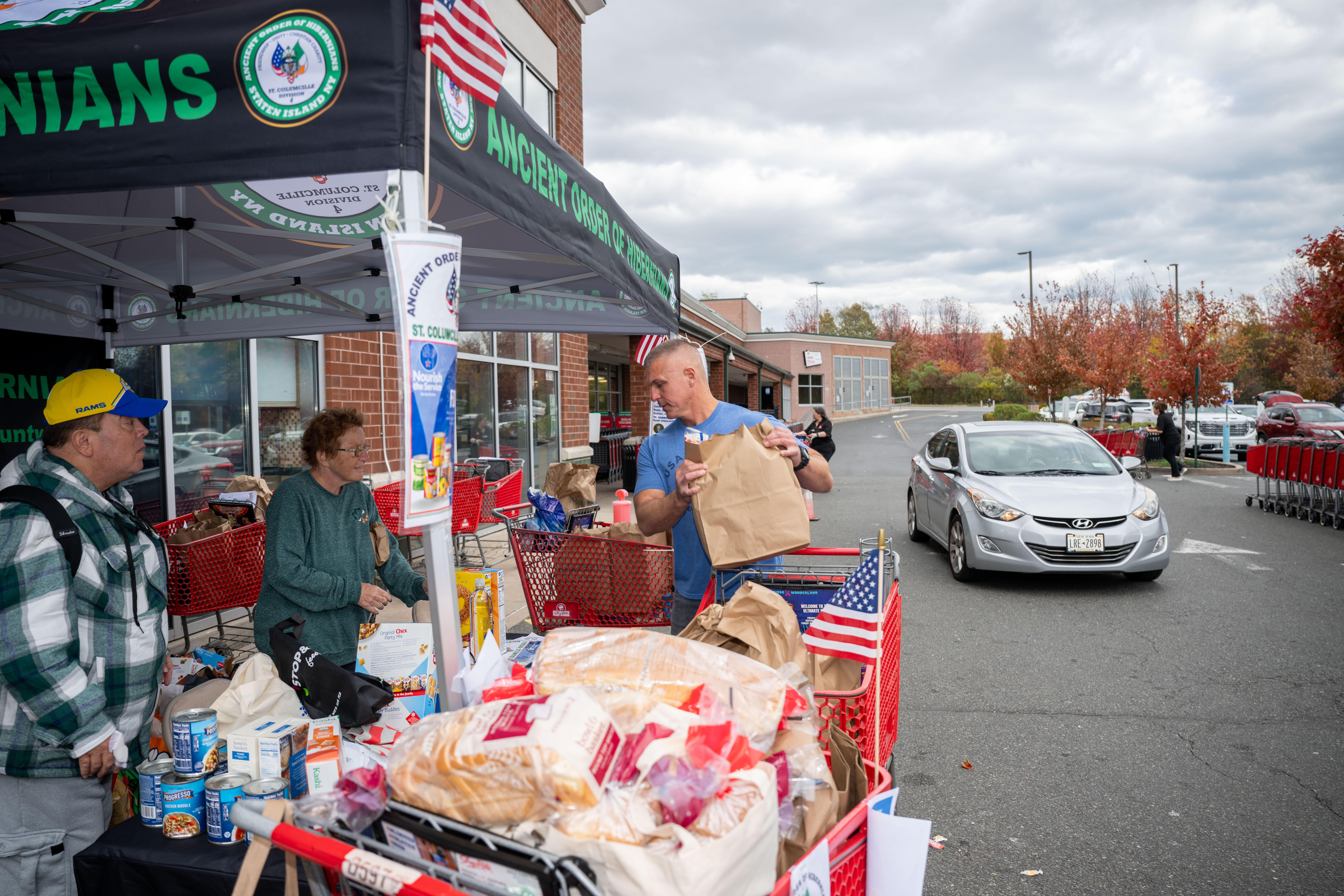 Hundreds of people donate food and/or money to the Ancient Order of Hibernians’ food drive for Blue Star Families on Saturday, November 1, 2025, in Charleston. The proceeds will benefit military families at Fort Wadsworth. (Owen Reiter for the Advance/SILive.com)