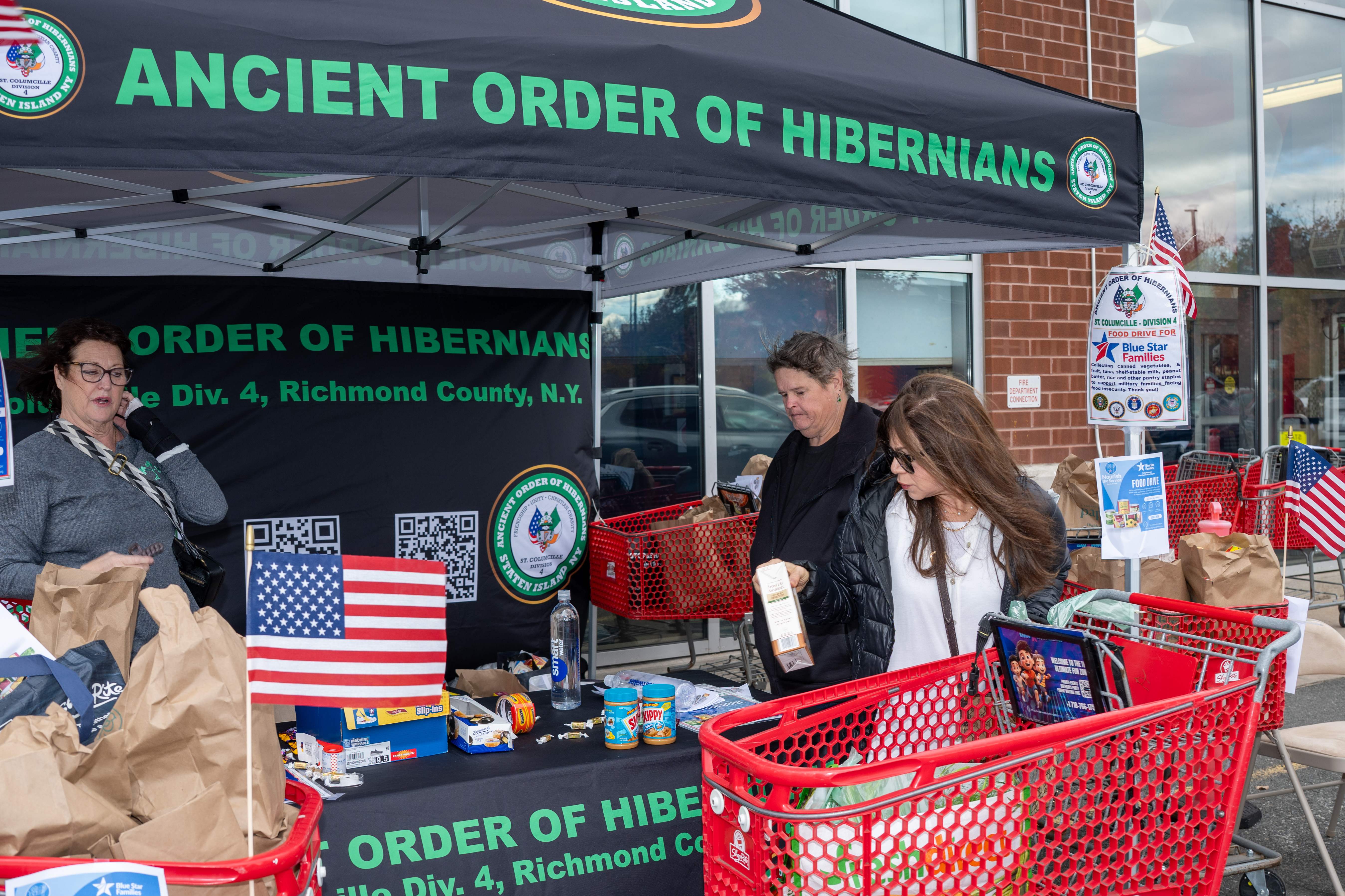 Hundreds of people donate food and/or money to the Ancient Order of Hibernians’ food drive for Blue Star Families on Saturday, November 1, 2025, in Charleston. The proceeds will benefit military families at Fort Wadsworth. (Owen Reiter for the Advance/SILive.com)
