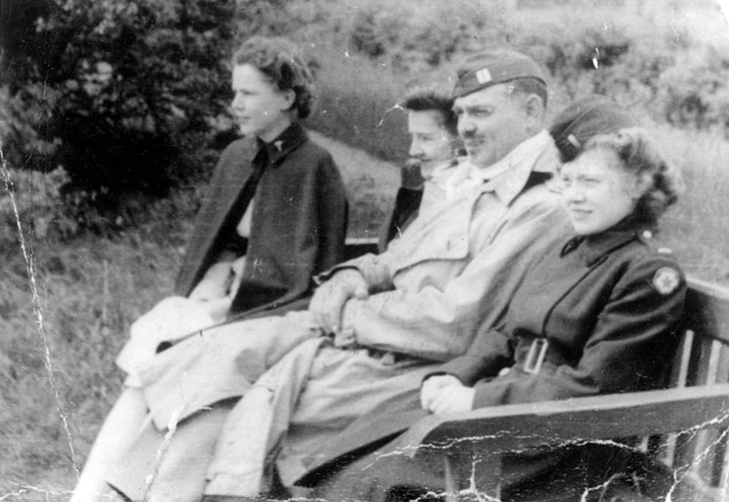 "My father always had this picture in his collection of army photos with his friends from his unit. The 30th general hospital was a large group of Physicians and surgeons based from San Francisco. The back of the picture was written Doris Miles, far end of bench, Capt. Clark Gable, and the nurse in front her name was 'Scotty'. The photo was taken in Mansfield England 1943. There was another photo of Clark Gable taken outside a medical building smoking with rest of Doctors from the 30th gen. hospital also from 1943 in England. The back of that photo has a acct # 1261, bag # and also it read customers property. The Army Press Corp. photographer made photos for the members of the unit to have. My father did tell me he was in the area when these photos were taken." (Submitted by Robert Moretti)