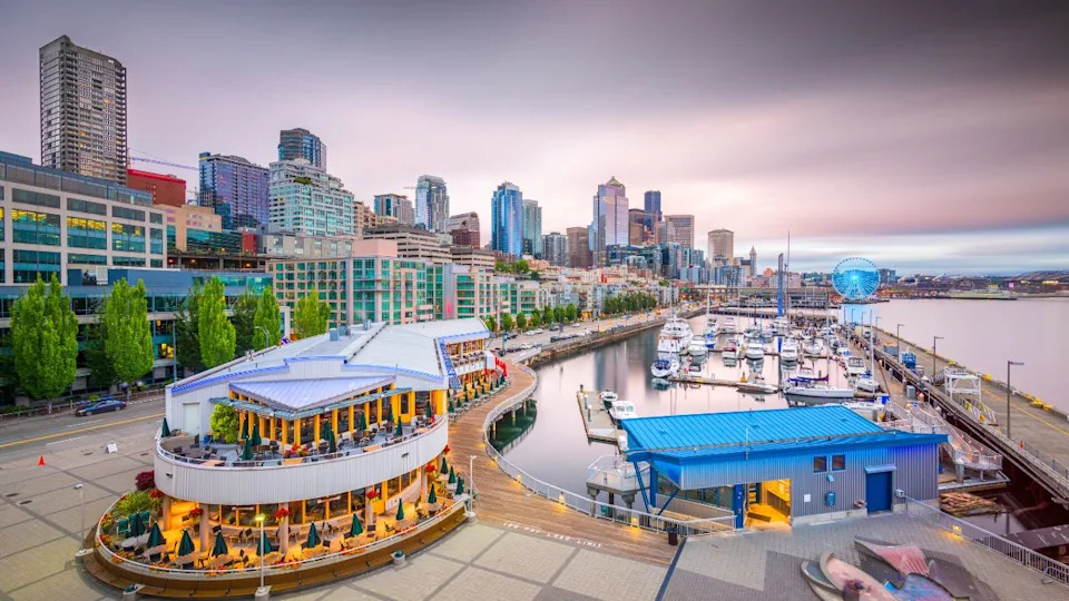 Seattle, Washington, USA pier and skyline at dusk.