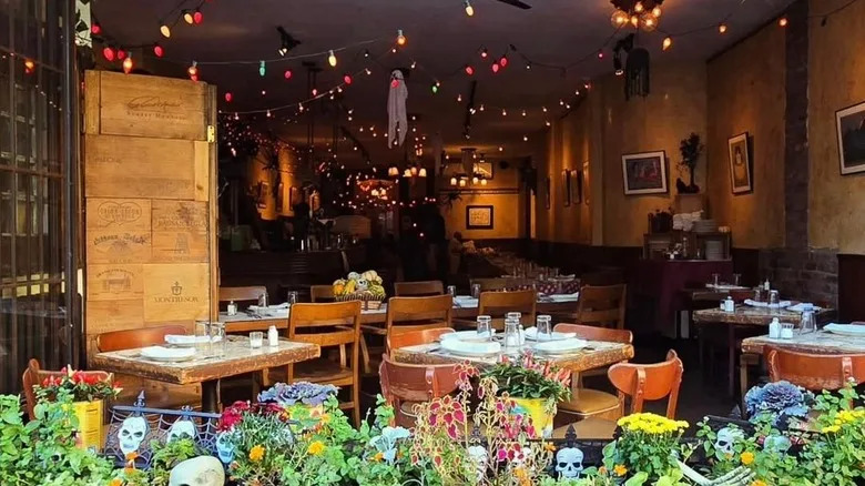 Interior view of the dining room at Brooklyn restaurant Noodle Pudding from its exterior sitting area