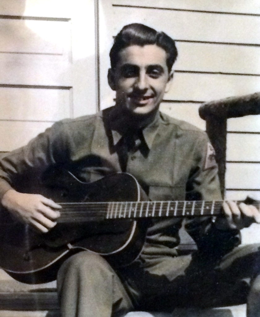 U.S. Army Medic, Saverio (Fred) LoPrimo of South Beach, who served in the 2nd Armored Division (Hell on Wheels) through Europe & Africa during World War II, 1941-1945. This photo taken while on active duty playing guitar for his unit. (Photo submitted by granddaughter Petrina LoPrimo)