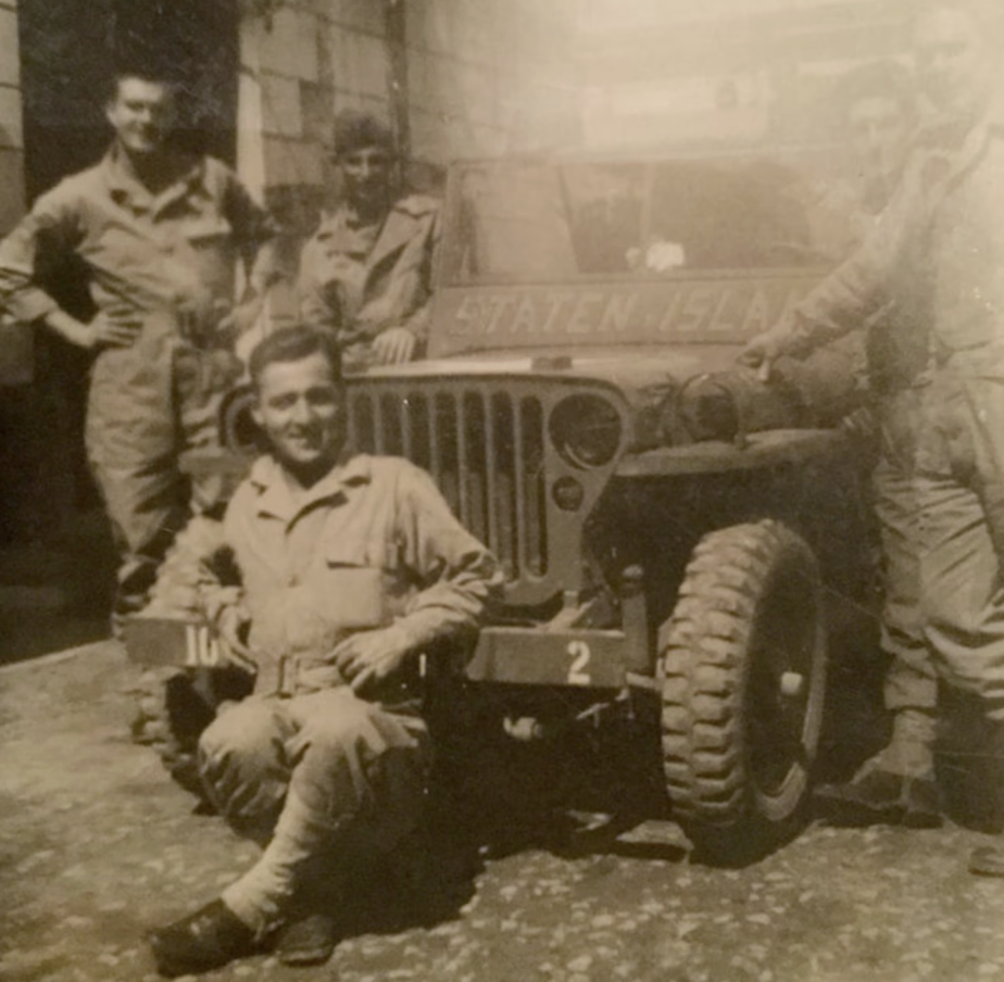 Pvt. Wilbur Rautenstrauch is the second person on the right side of Jeep. Jack McGinley the legendary coach of St.Peter’s Boys basketball (standing on left side of jeep). The photo was taken in Sicily 1944. Notice “Staten Island” is written on the Jeep. (Submitted by Bill Rautenstrauch)