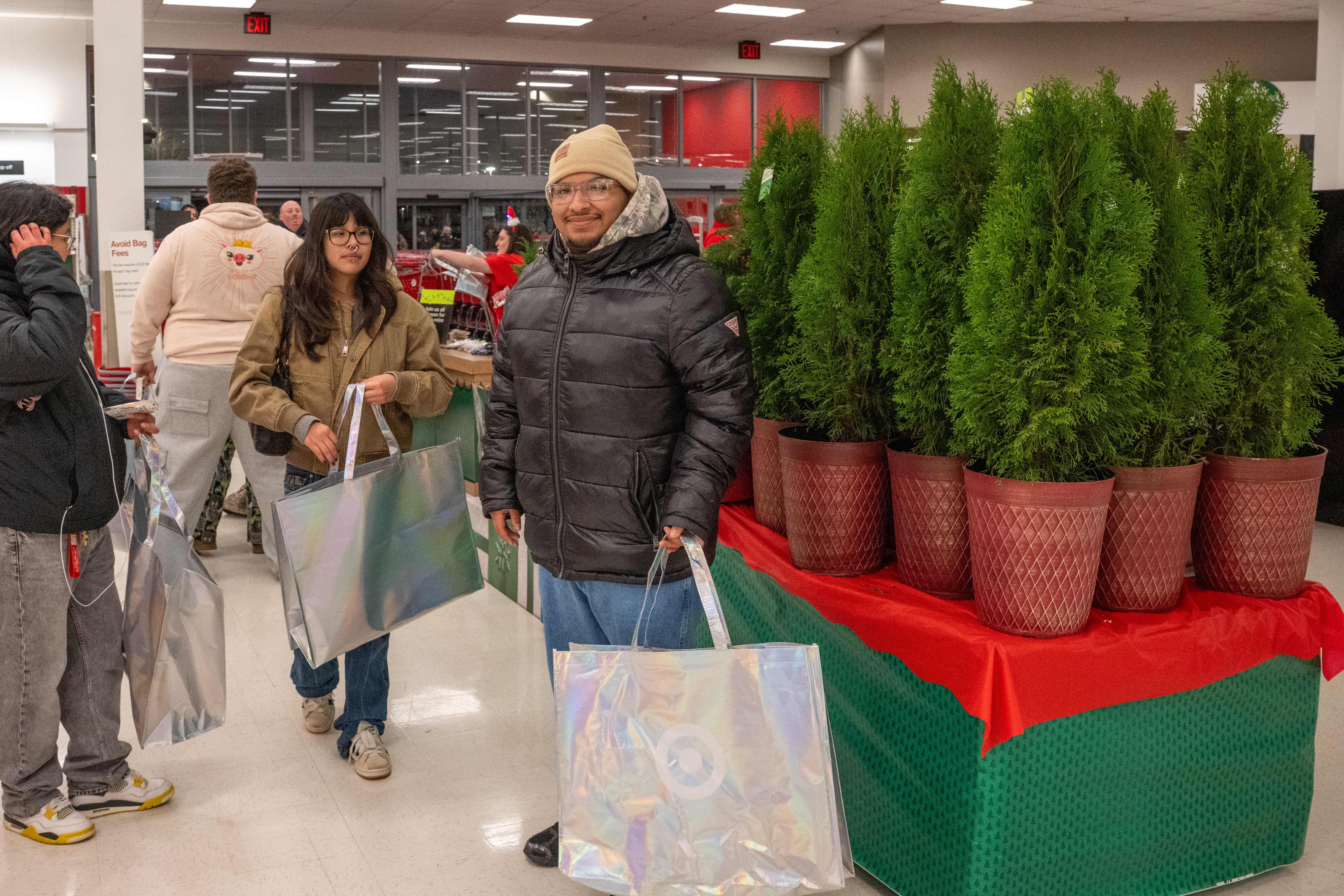 Angel Quintana from Graniteville is the first shopper to enter Target at the Bricktown Shopping Center on Friday, November 28, 2025, in Charleston. (Owen Reiter for the Advance/SILive.com)