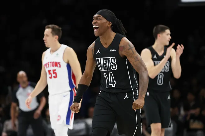 Brooklyn Nets guard Terance Mann (14) reacts after making a defensive stop during the first half of an NBA Cup basketball game against the Detroit Pistons, Friday, Nov. 7, 2025, in New York. (AP Photo/Heather Khalifa)