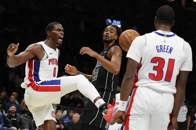 Detroit Pistons center Jalen Duren (0) and teammate Javonte Green (31) react after Duren's dunk past Brooklyn Nets center Nic Claxton (33) during the second half of an NBA Cup basketball game, Friday, Nov. 7, 2025, in New York. (AP Photo/Heather Khalifa)