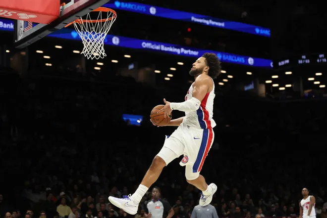 Detroit Pistons guard Cade Cunningham (2) dunks the ball during the second half of an NBA Cup basketball game against the Brooklyn Nets, Friday, Nov. 7, 2025, in New York. (AP Photo/Heather Khalifa)