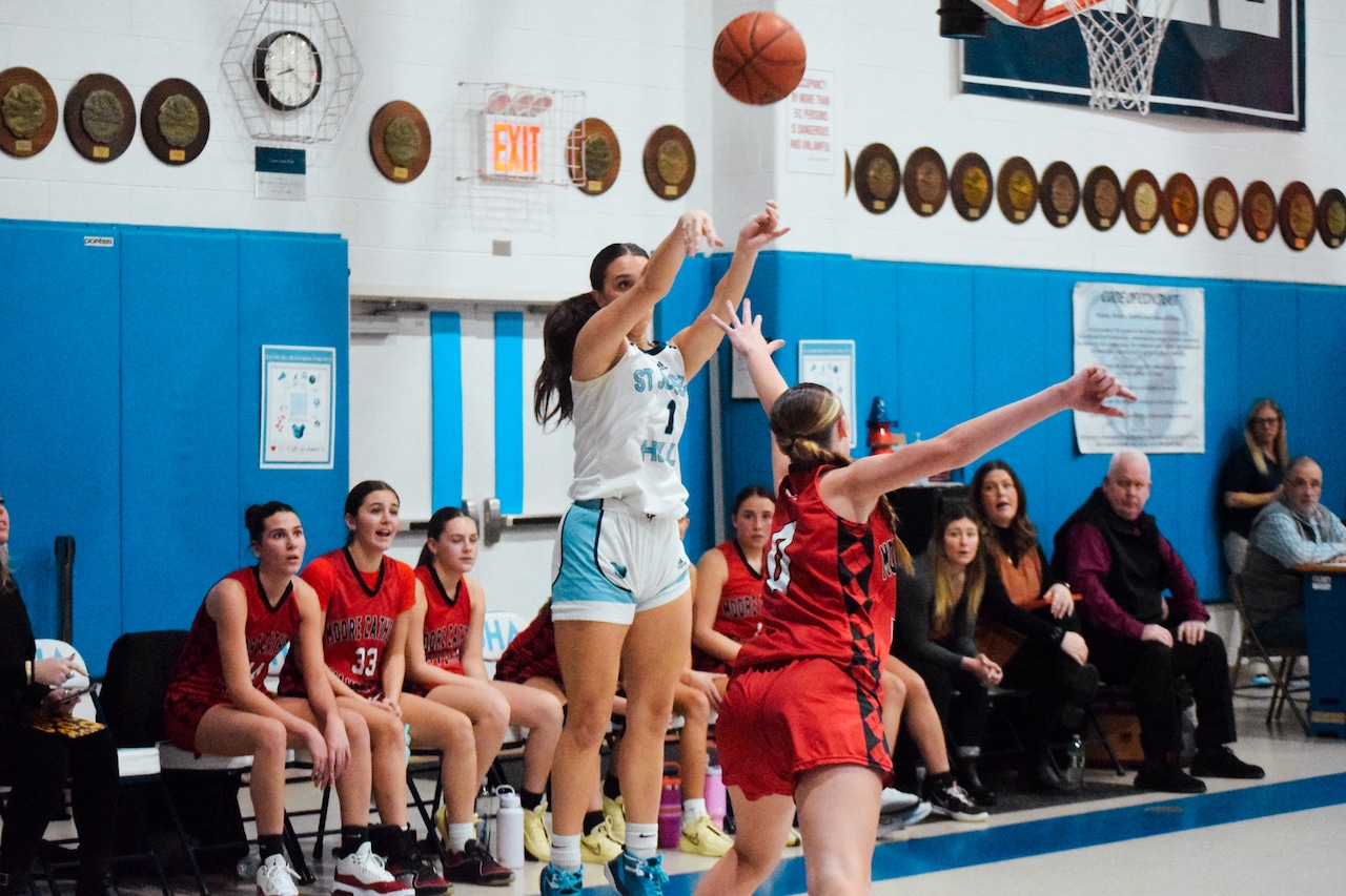 Second-half surge propels Moore over Hill, 66-44