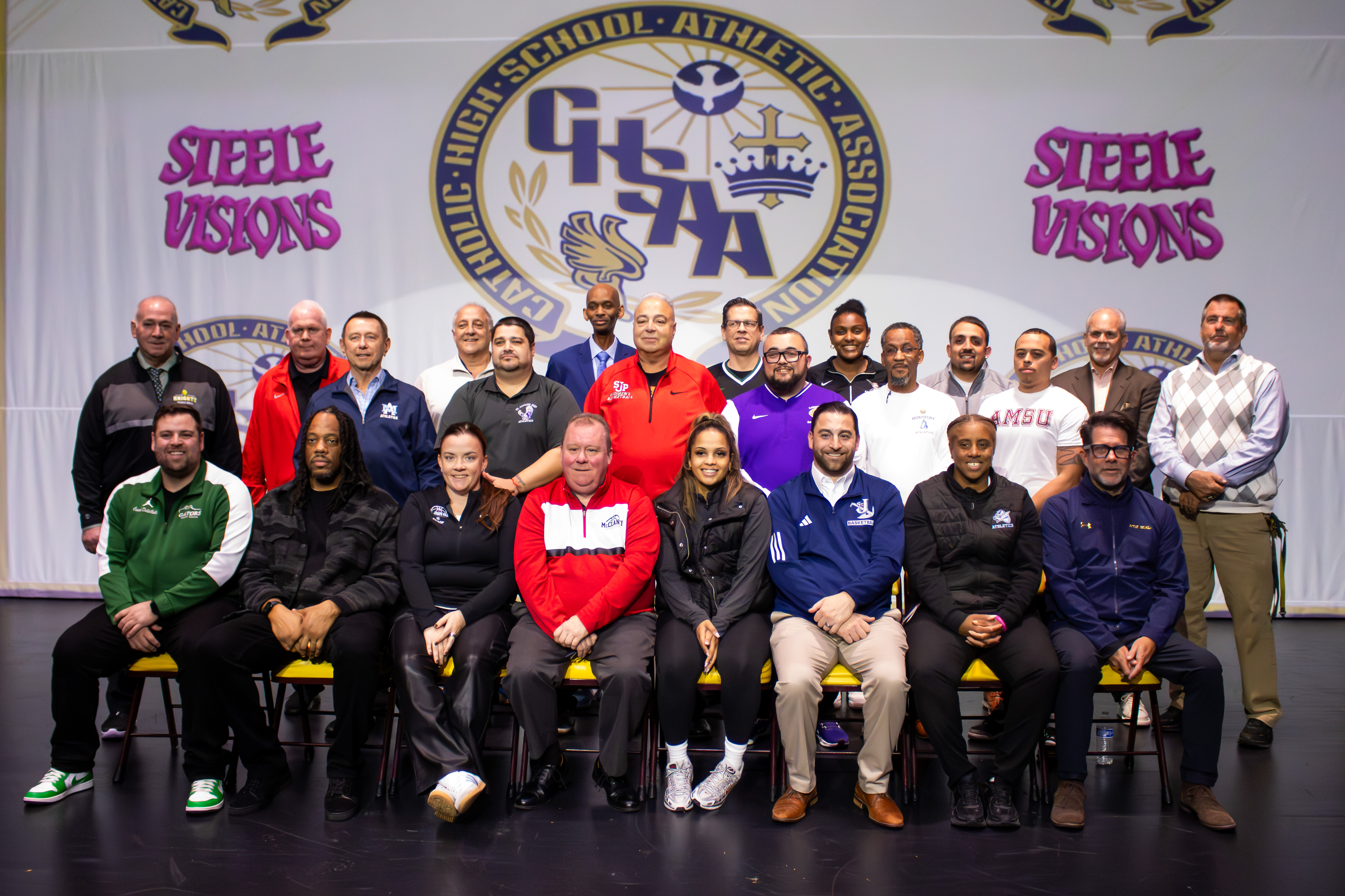 All four Staten Island CHSAA schools, alongside 26 other teams across the league, took part in the second annual event at Christ the King Monday evening. The CHSAA's head coaches smile for a group photo. (Annie DeBiase for the Advance/SILive.com)
