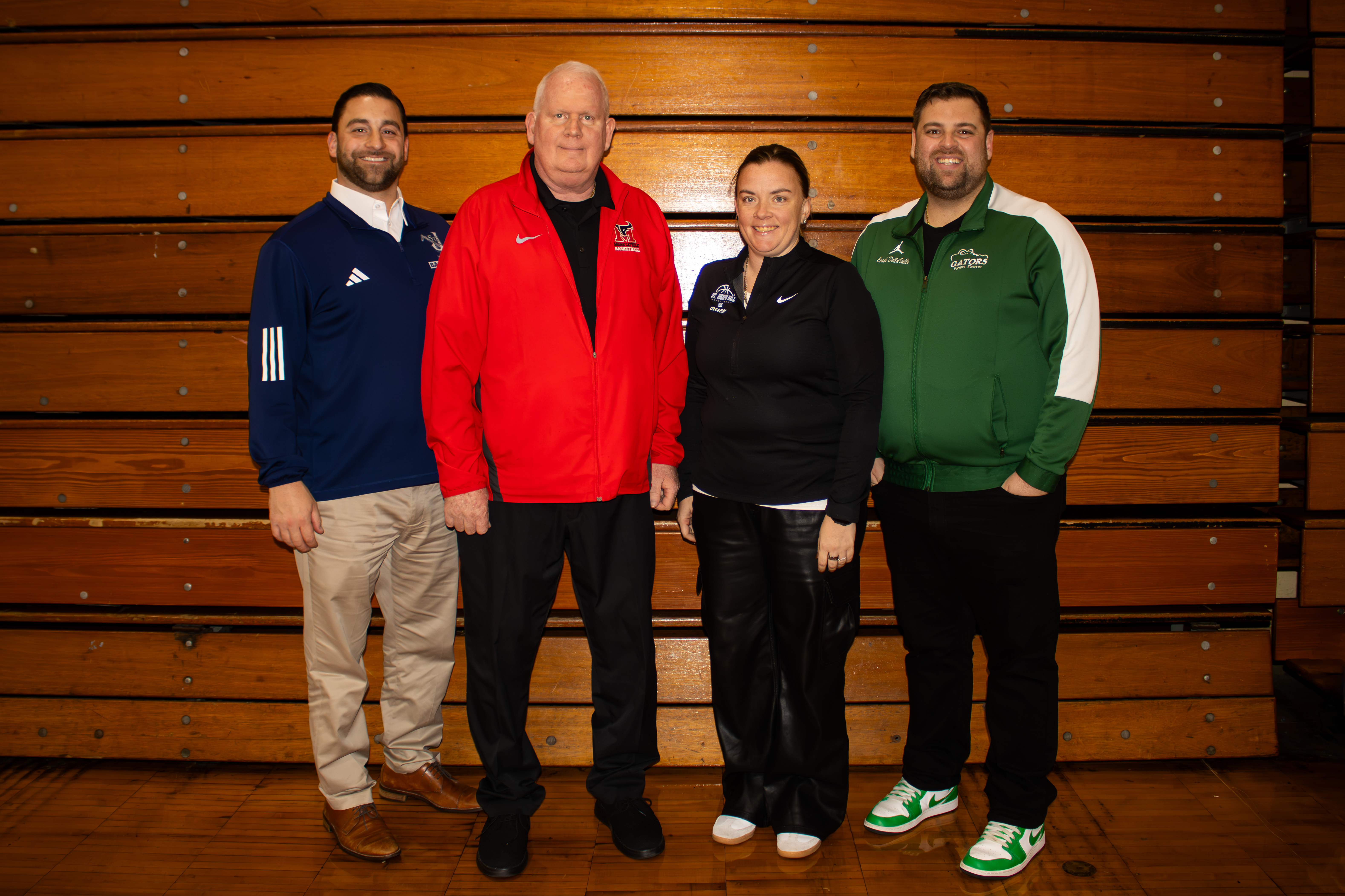 All four Staten Island CHSAA schools, alongside 26 other teams across the league, took part in the second annual event at Christ the King Monday evening. From left to right, head coaches Josh Suslak (Sea), Gene Henderson (Moore), Ashley Vogel (Hill) and Bobby DellaValle (NDA) smile for a photo. (Annie DeBiase for the Advance/SILive.com)