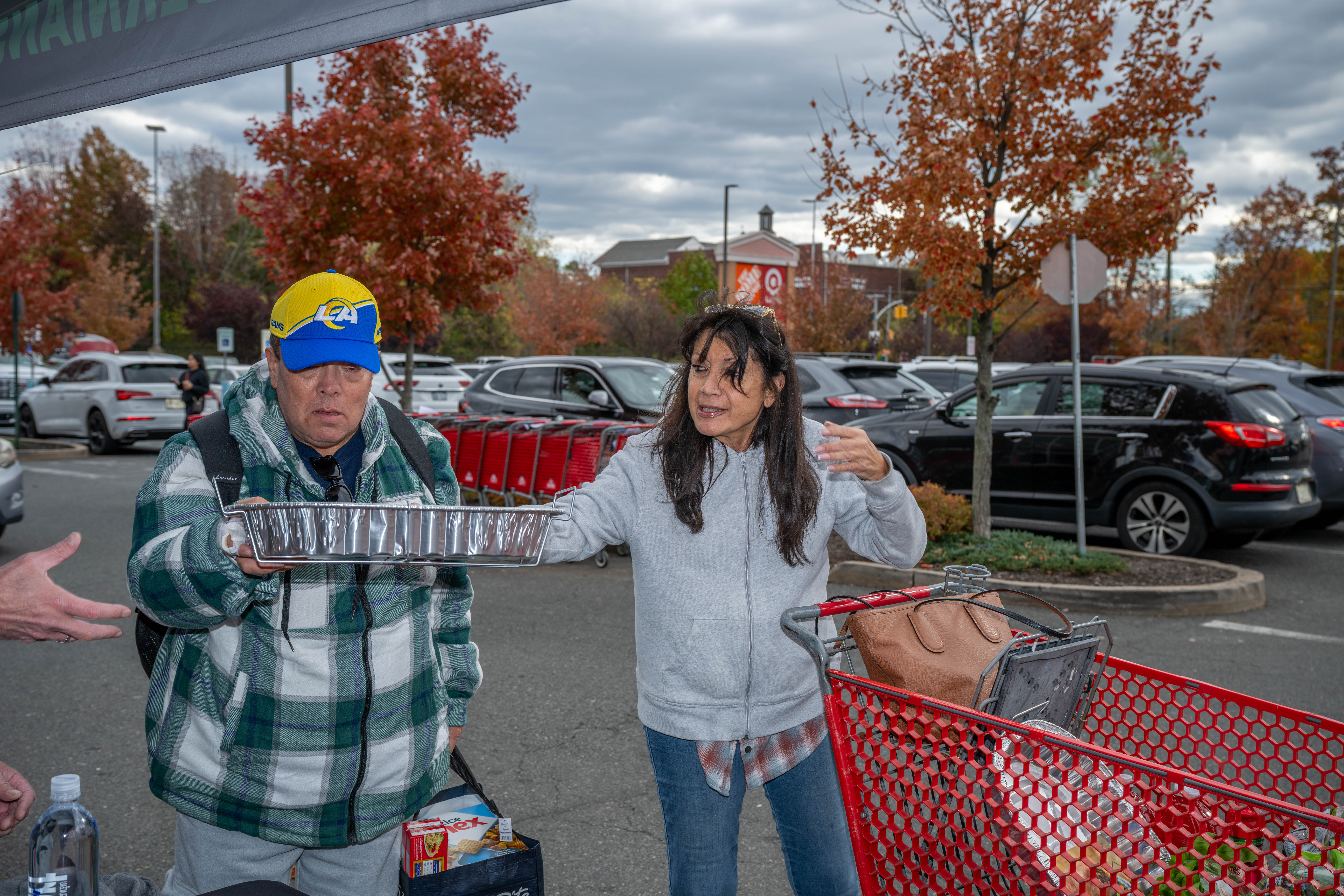 Renee Dambakly from Rossville donates food to the Ancient Order of Hibernians’ food drive for Blue Star Families on Saturday, November 1, 2025, in Charleston. The proceeds will benefit military families at Fort Wadsworth. (Owen Reiter for the Advance/SILive.com)