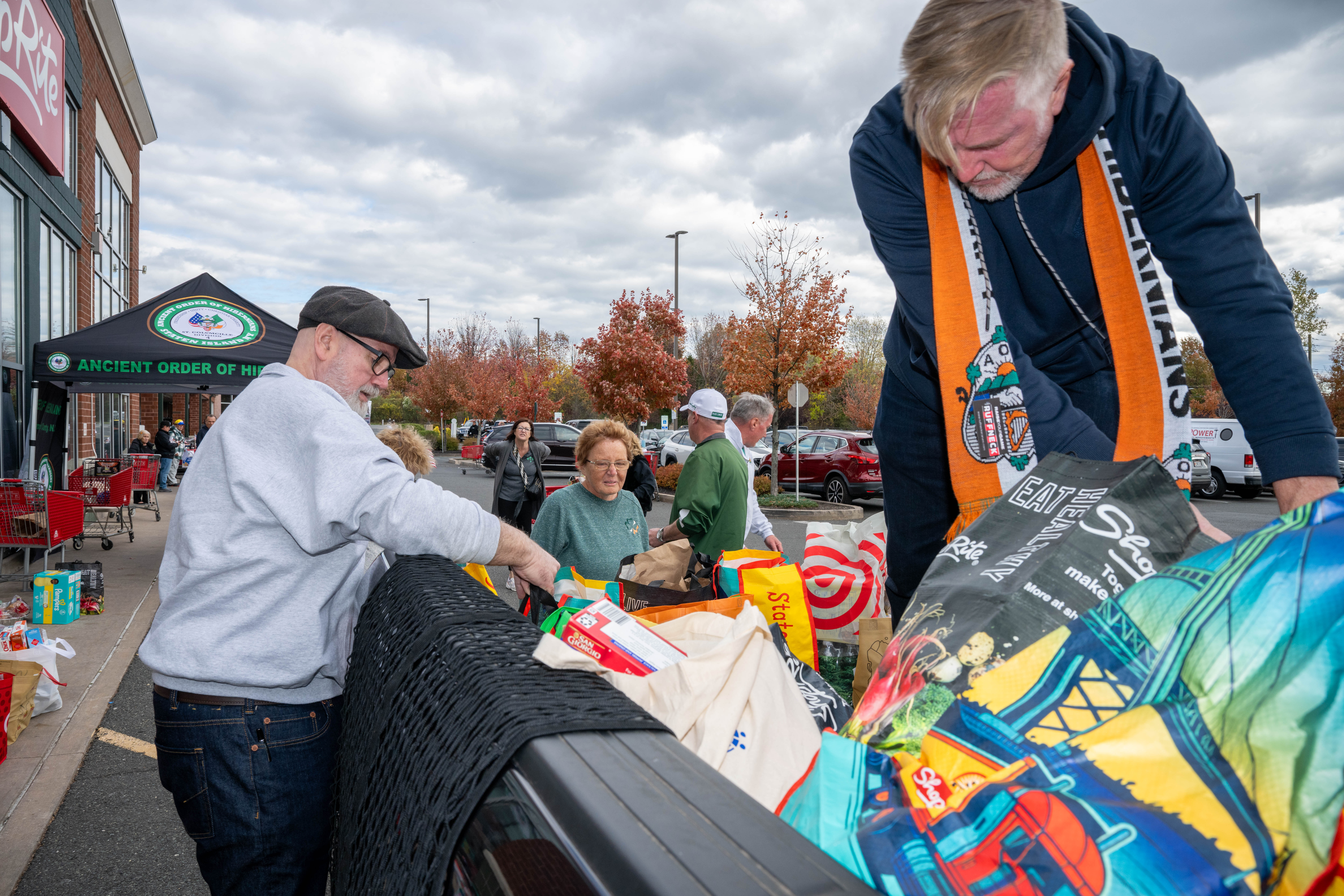 Hundreds of people donate food and/or money to the Ancient Order of Hibernians’ food drive for Blue Star Families on Saturday, November 1, 2025, in Charleston. The proceeds will benefit military families at Fort Wadsworth. (Owen Reiter for the Advance/SILive.com)