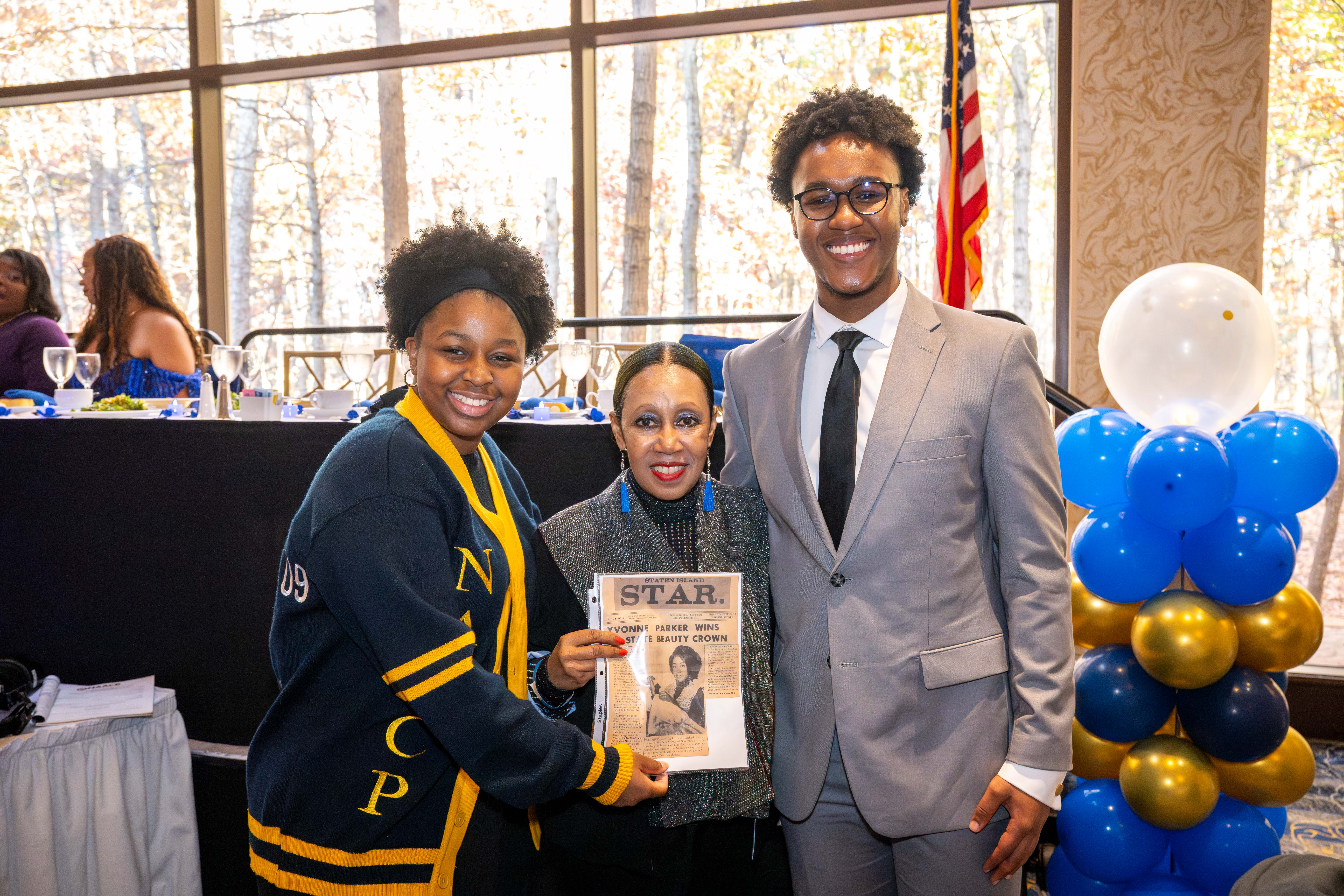 Yvonne Patricia Parker Curry, 76, who served as the Staten Island Branch Youth Council President in 1966, poses with Xzayla Wilson, 16, the current Staten Island Branch Youth Council President, and Myles Hollingsworth, the NY State Conference Youth and College Division President, at the Staten Island NAACP’s Freedom Fund Luncheon held at Nicotra’s Ballroom at the Hilton Garden Inn on Saturday, November 8, 2025, in Bloomfield. The milestone event marked 100 years of service to the community. (Owen Reiter for the Advance/SILive.com)