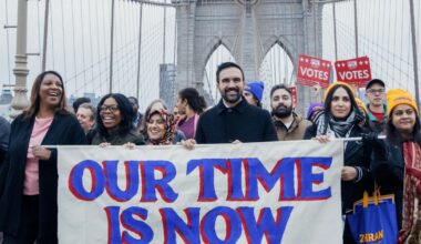 Zohran Mamdani and supporters walk the Brooklyn Bridge on November 3, 2025.