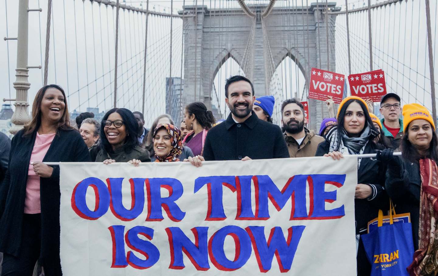 Zohran Mamdani and supporters walk the Brooklyn Bridge on November 3, 2025.