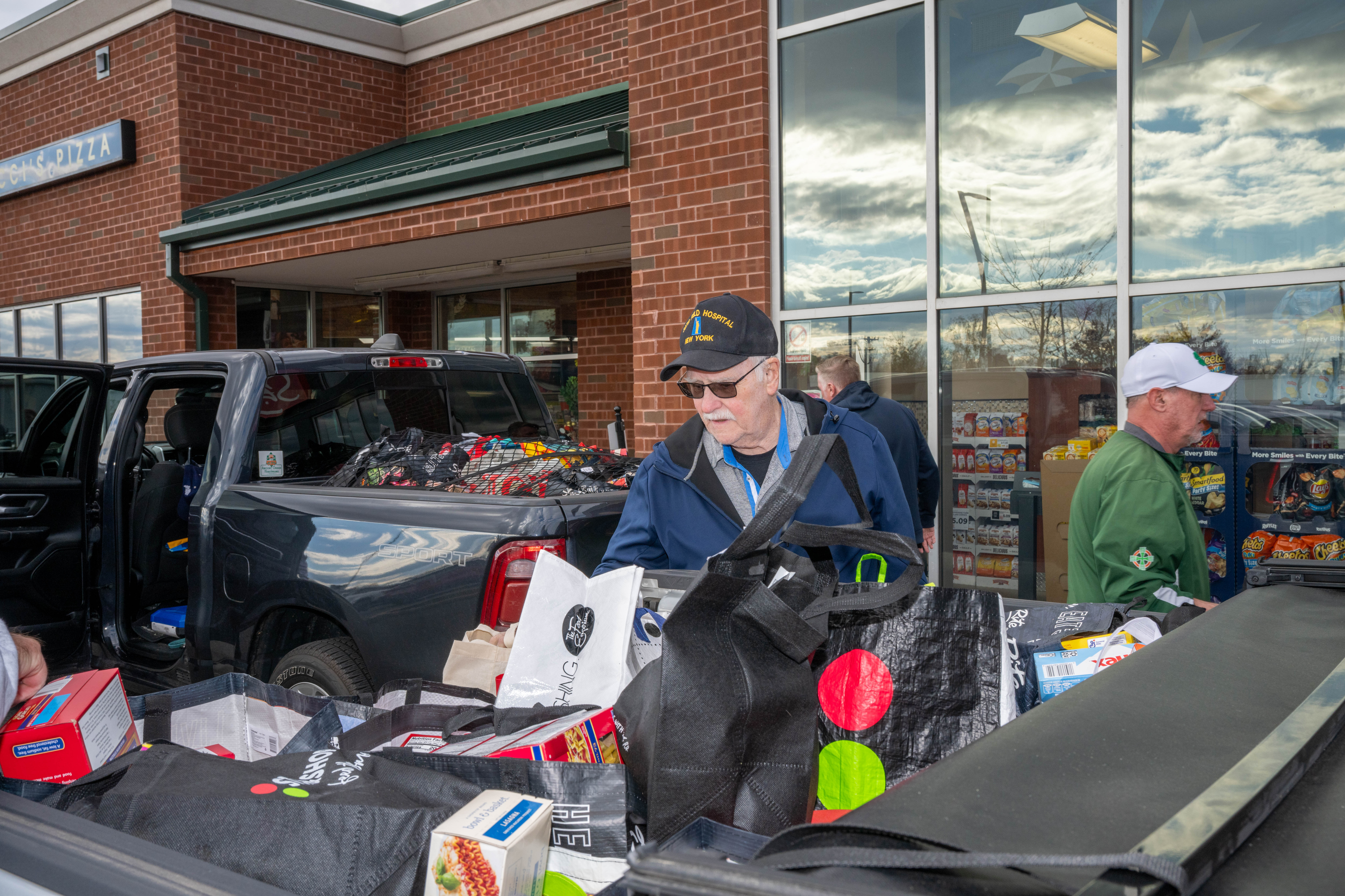 Hundreds of people donate food and/or money to the Ancient Order of Hibernians’ food drive for Blue Star Families on Saturday, November 1, 2025, in Charleston. The proceeds will benefit military families at Fort Wadsworth. (Owen Reiter for the Advance/SILive.com)