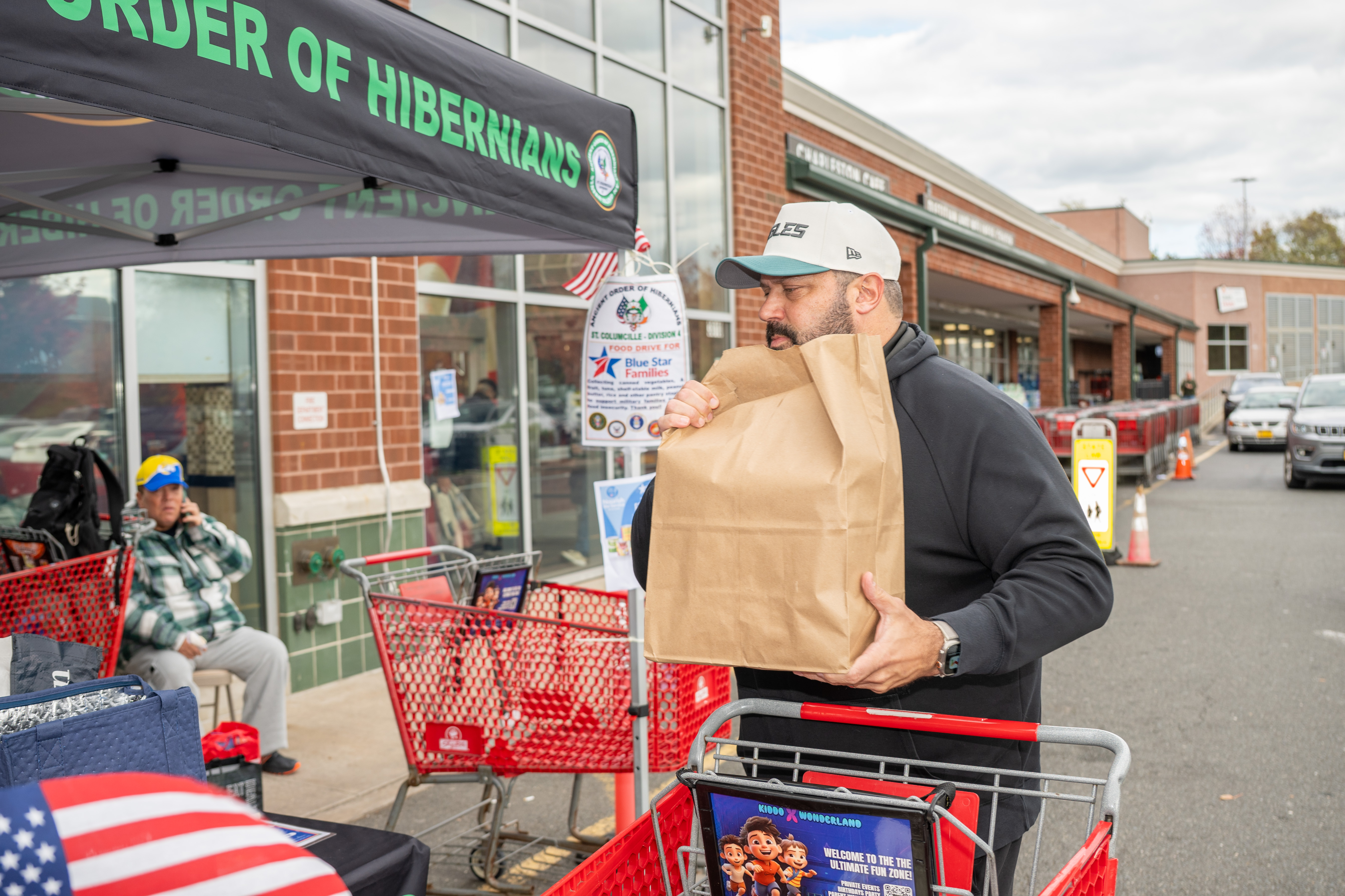Hundreds of people donate food and/or money to the Ancient Order of Hibernians’ food drive for Blue Star Families on Saturday, November 1, 2025, in Charleston. The proceeds will benefit military families at Fort Wadsworth. (Owen Reiter for the Advance/SILive.com)