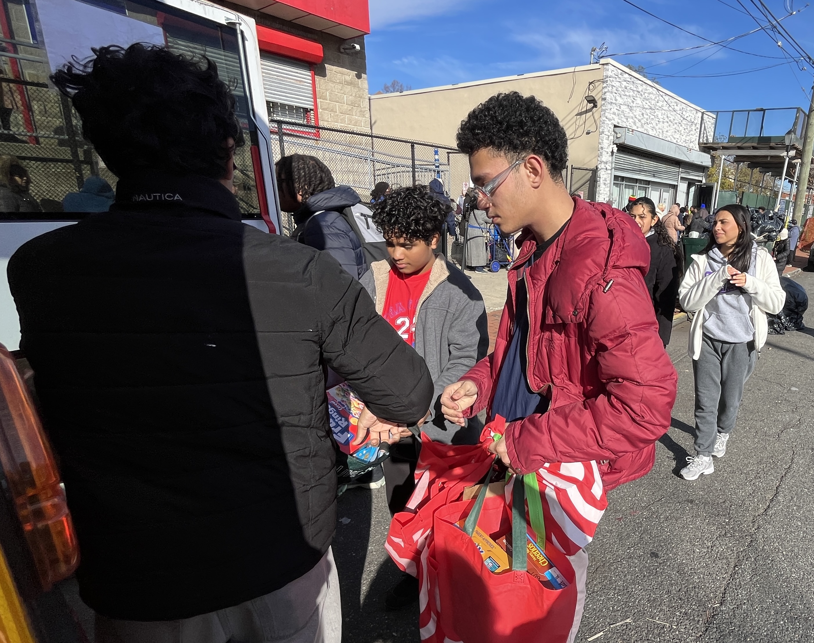 Eagle Academy students volunteers help organize the food drive at Project Hospitality in Stapleton  to help feed Staten Islanders in need. (Advance/SILive.com | Jan Somma-Hammel)
