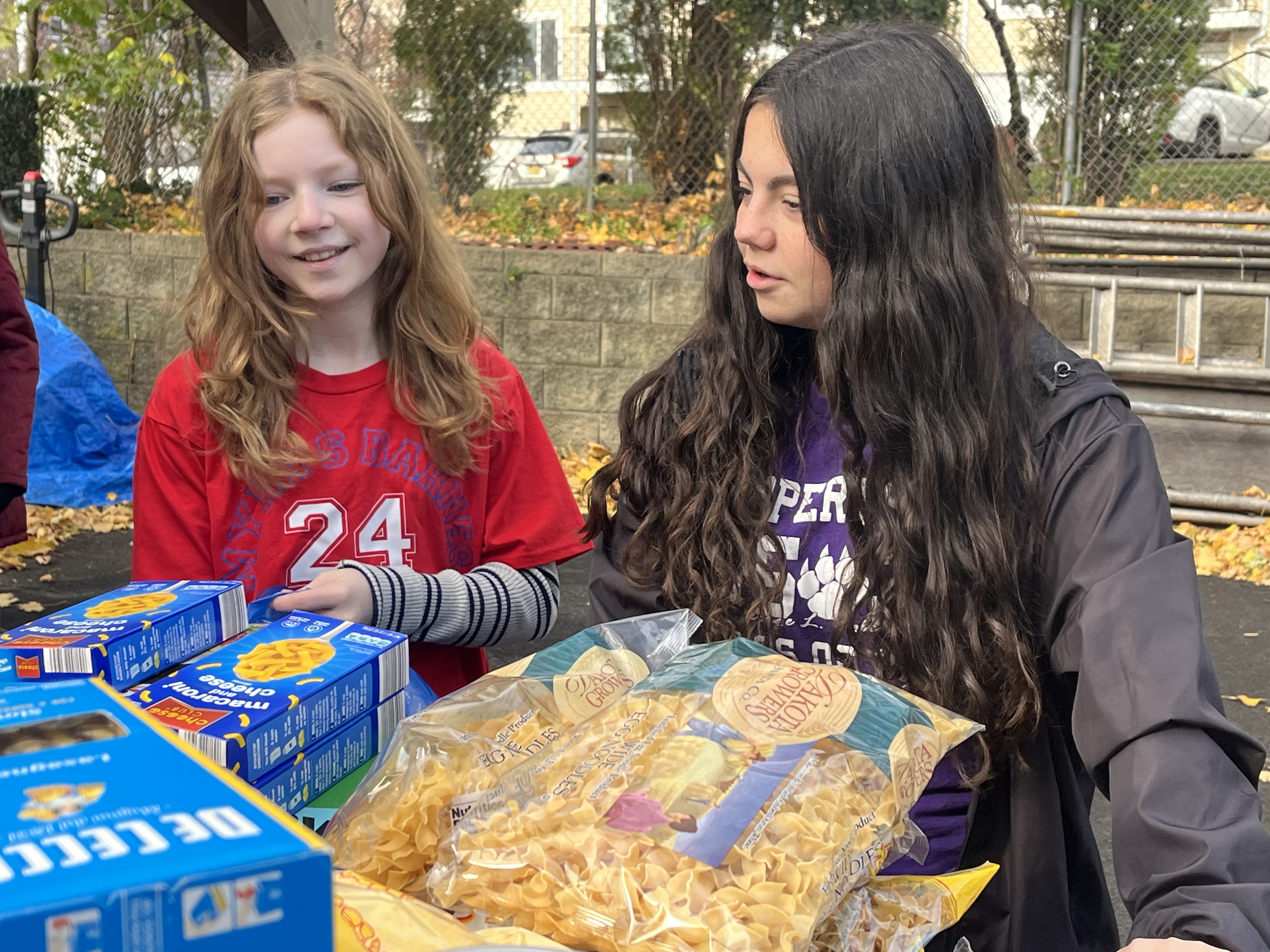Students volunteer their time ahead of the annual Project Hospitality Poor People's Dinner, which is on Monday to sort food donations and feed the hungry. Ere Maeve McVay, 7th grader from I.S. 24 says ÓI think everyone deserves to have a nice healthy meal with their familyÓ. Next to her is Ally Ryan, a 7th grader from I.S. 2. She says ÒI think everyone needs to know that people are there for them when they need helpÓ. (Advance/SILive.com | Jan Somma-Hammel)