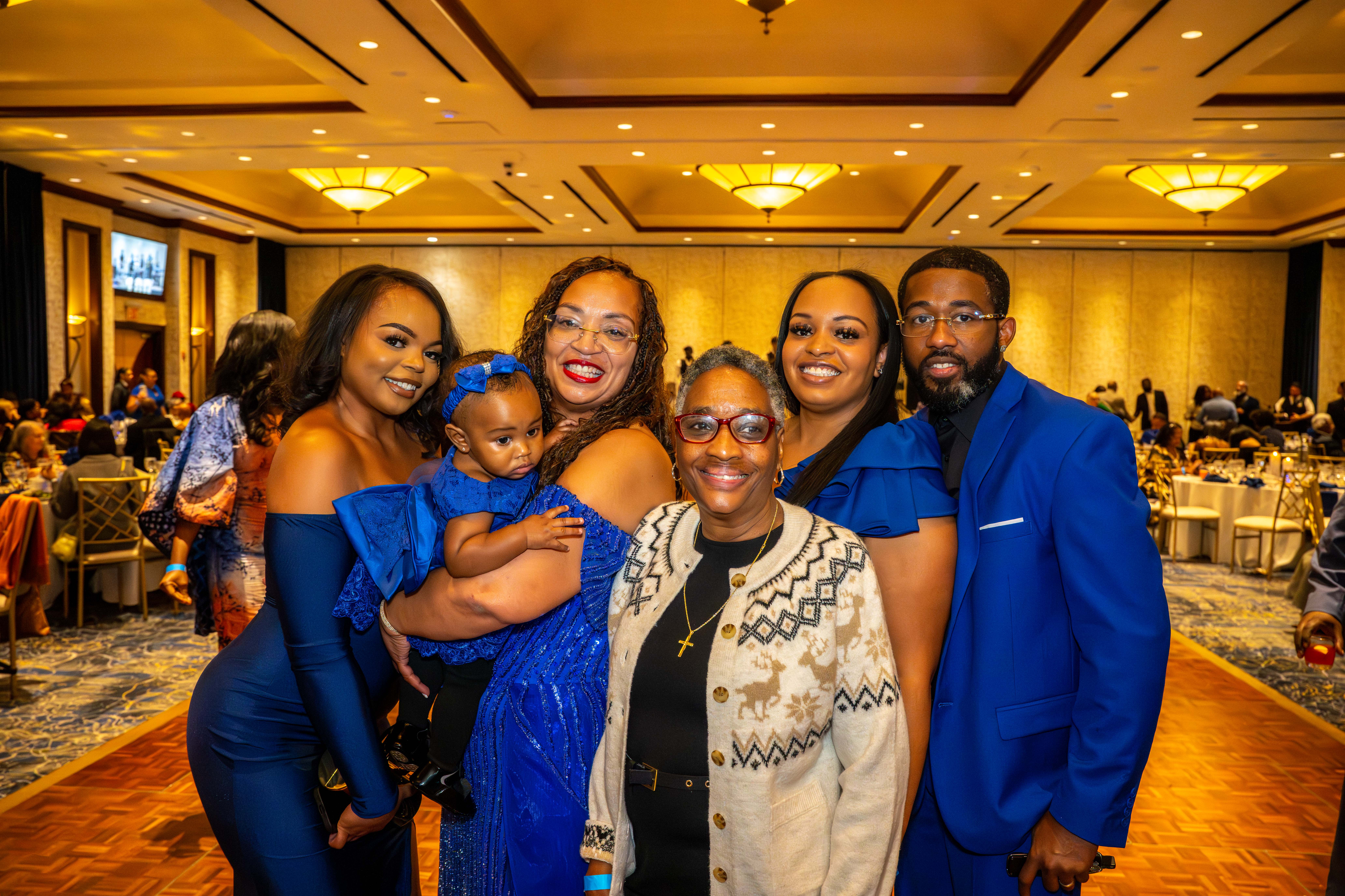 Staten Island Branch President Nicole Myers holds her granddaughter, Navaeh Jackson, 1. She is joined by her family, Nia Meyers, Judy Singleton, Ajene, and Nicholas Jackson, at the Staten Island NAACP’s Freedom Fund Luncheon held at Nicotra’s Ballroom at the Hilton Garden Inn on Saturday, November 8, 2025, in Bloomfield. The milestone event marked 100 years of service to the community. (Owen Reiter for the Advance/SILive.com)