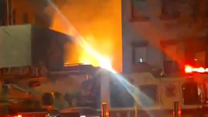 Massive blaze at outdoor beer garden in Manhattan spreads to nearby building