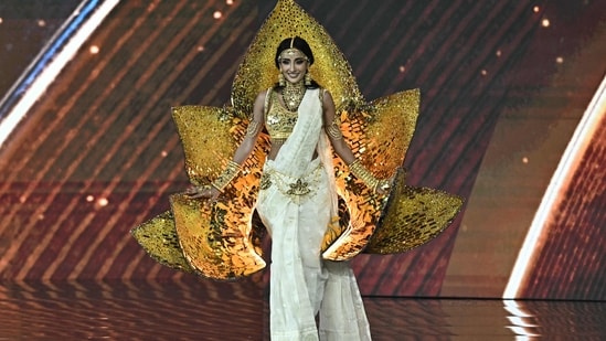 Miss Bangladesh Tangia Zaman Methila walks on stage.(AFP)