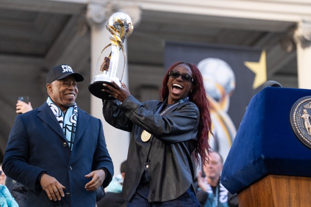 A Gotham FC team member arrives on stage during a ceremony at New York City Hall celebrating Gotham FC's 2025 Championship season Monday, Nov. 24, 2025 in Manhattan, New York. (Barry Williams/ New York Daily News)