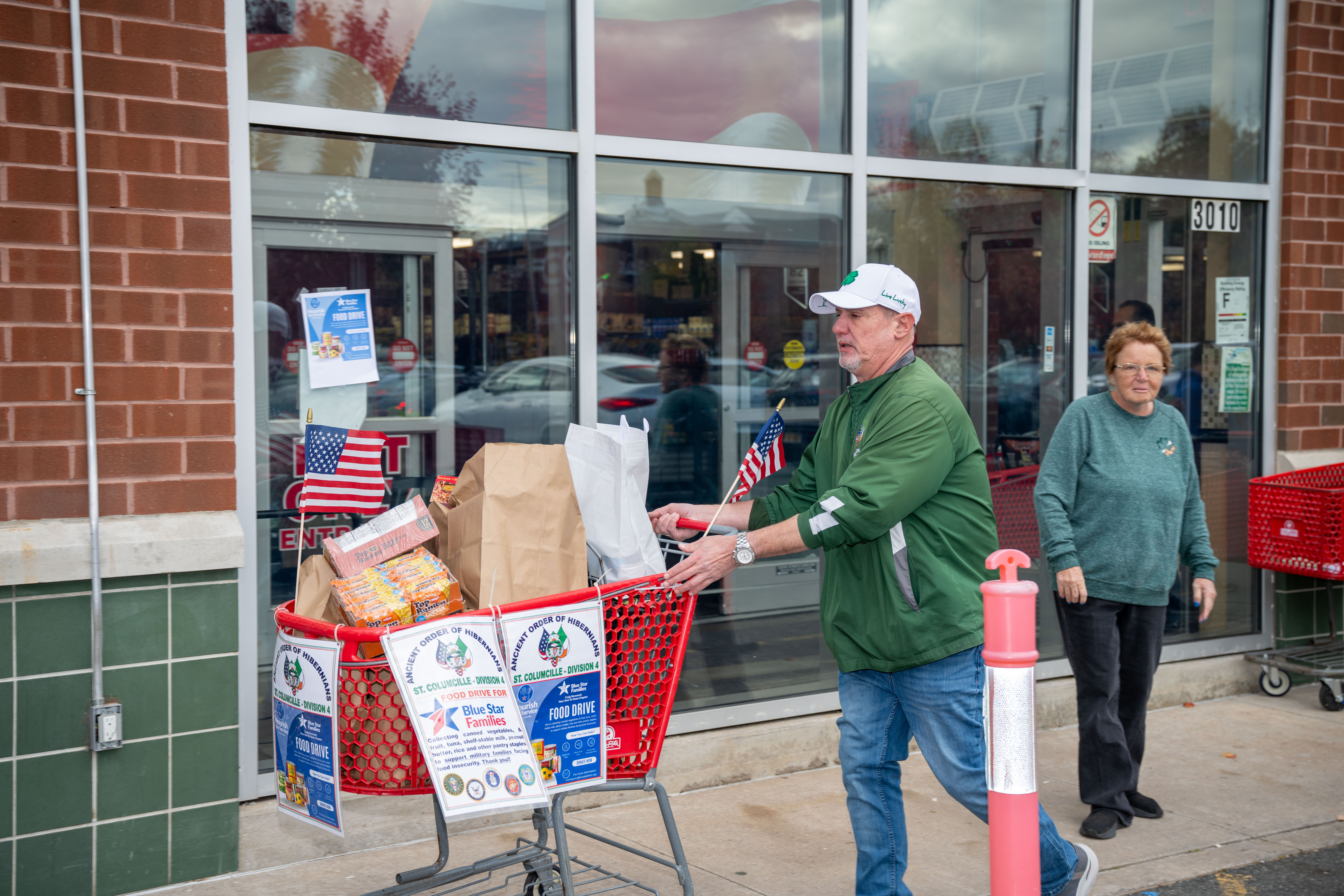 George Gillis, president of Division 4, collects donated items at the Ancient Order of Hibernians’ food drive for Blue Star Families on Saturday, November 1, 2025, in Charleston. The proceeds will benefit military families at Fort Wadsworth. (Owen Reiter for the Advance/SILive.com)