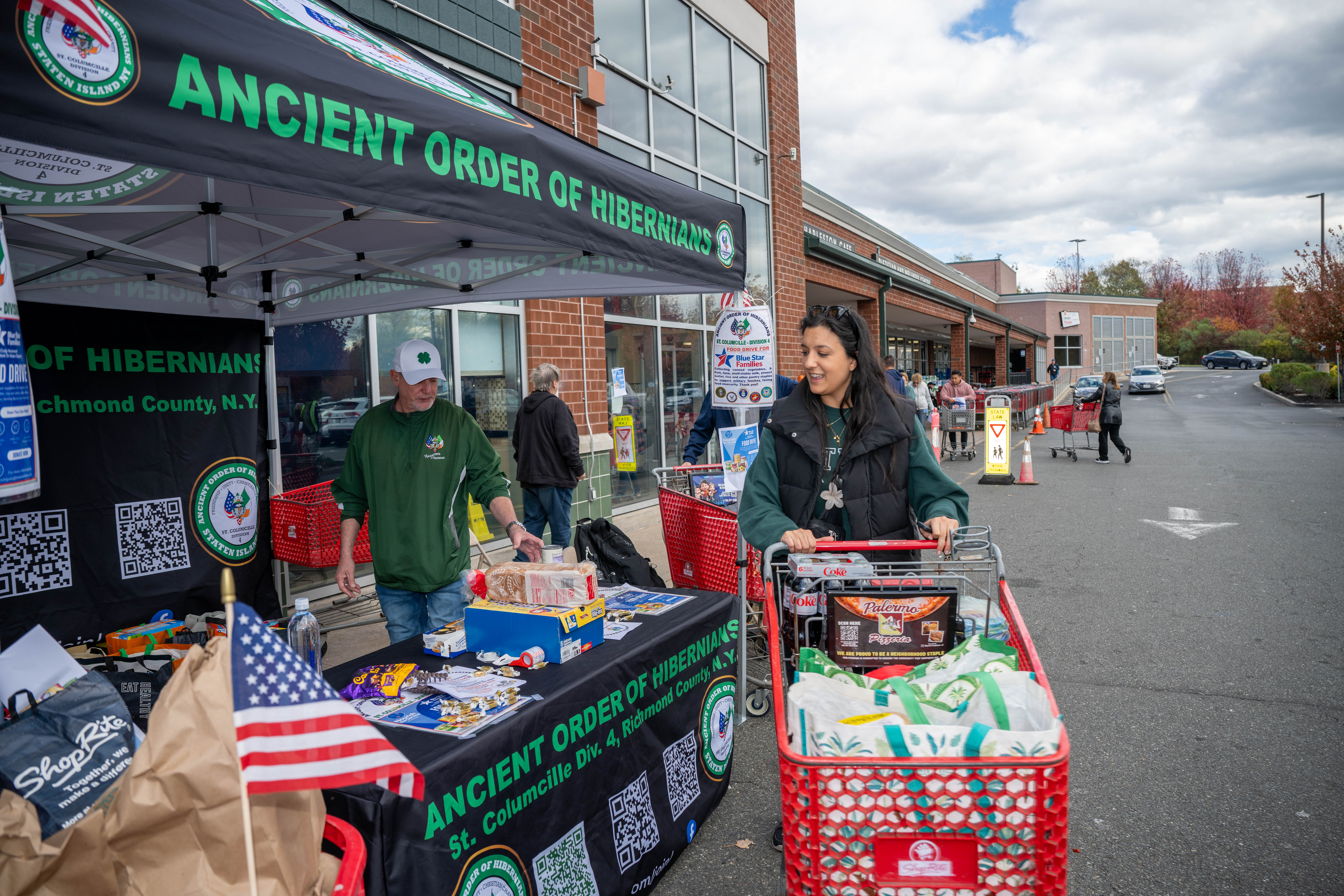 Hundreds of people donate food and/or money to the Ancient Order of Hibernians’ food drive for Blue Star Families on Saturday, November 1, 2025, in Charleston. The proceeds will benefit military families at Fort Wadsworth. (Owen Reiter for the Advance/SILive.com)