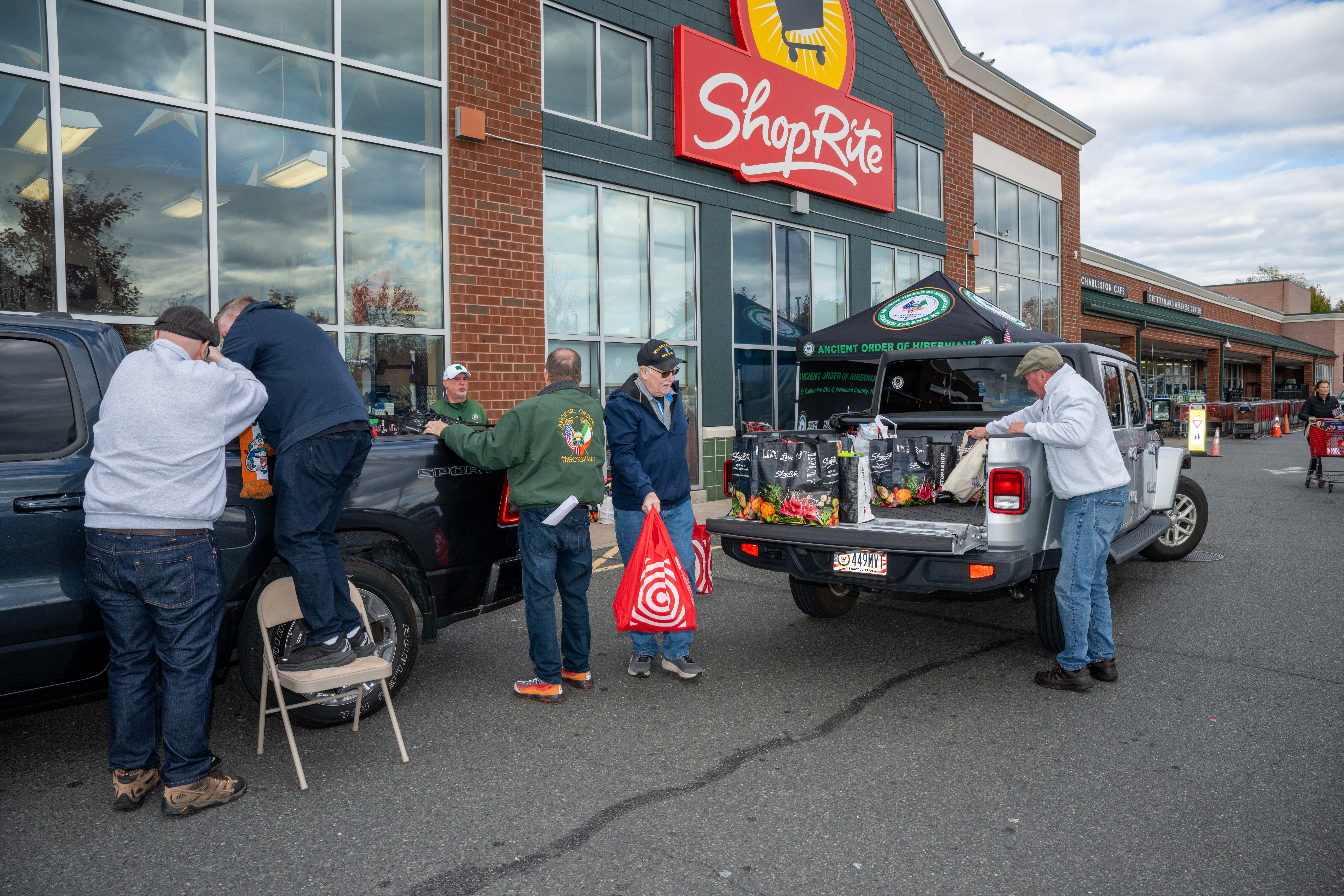 Hundreds of people donate food and/or money to the Ancient Order of Hibernians’ food drive for Blue Star Families on Saturday, November 1, 2025, in Charleston. The proceeds will benefit military families at Fort Wadsworth. (Owen Reiter for the Advance/SILive.com)
