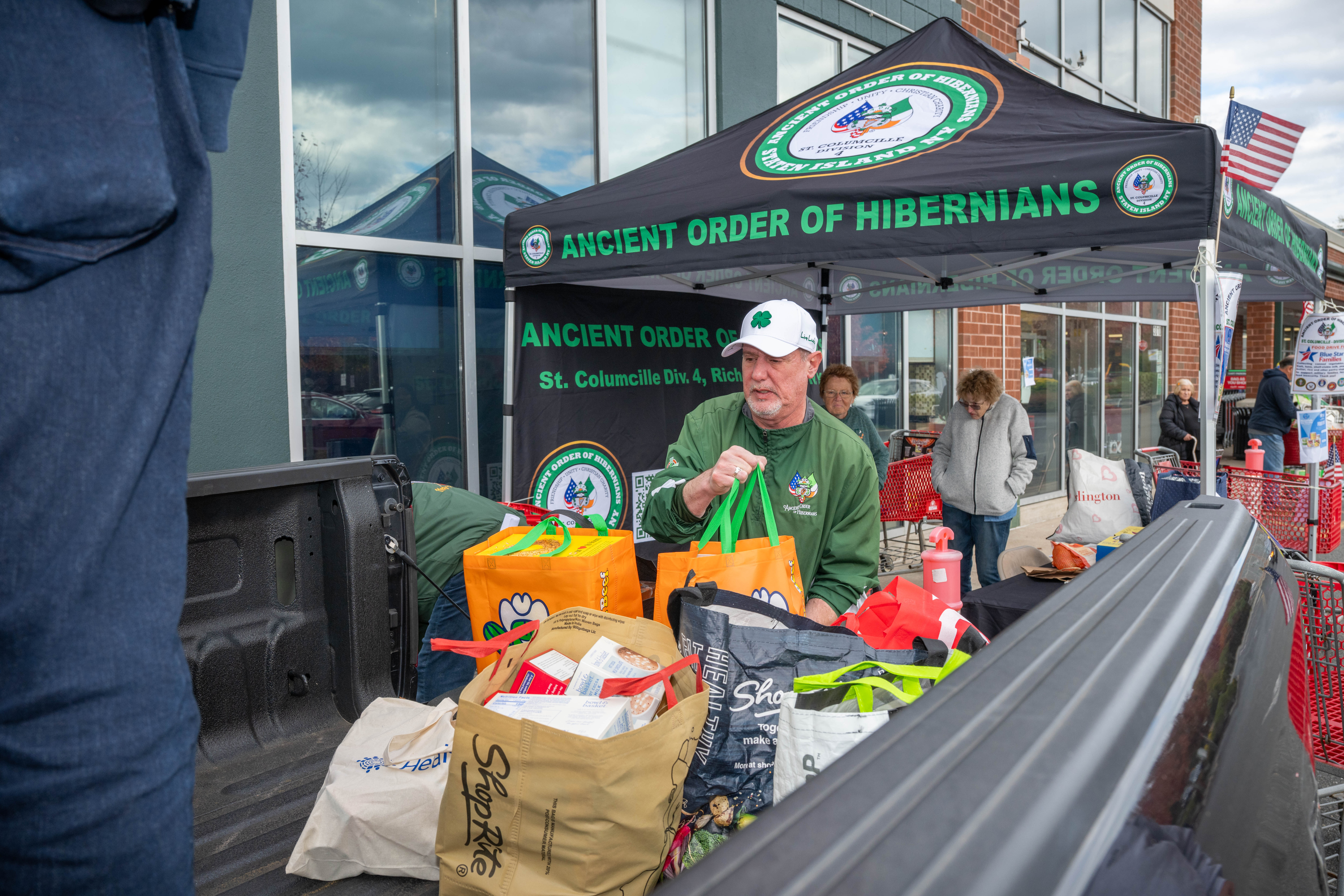 Hundreds of people donate food and/or money to the Ancient Order of Hibernians’ food drive for Blue Star Families on Saturday, November 1, 2025, in Charleston. The proceeds will benefit military families at Fort Wadsworth. (Owen Reiter for the Advance/SILive.com)